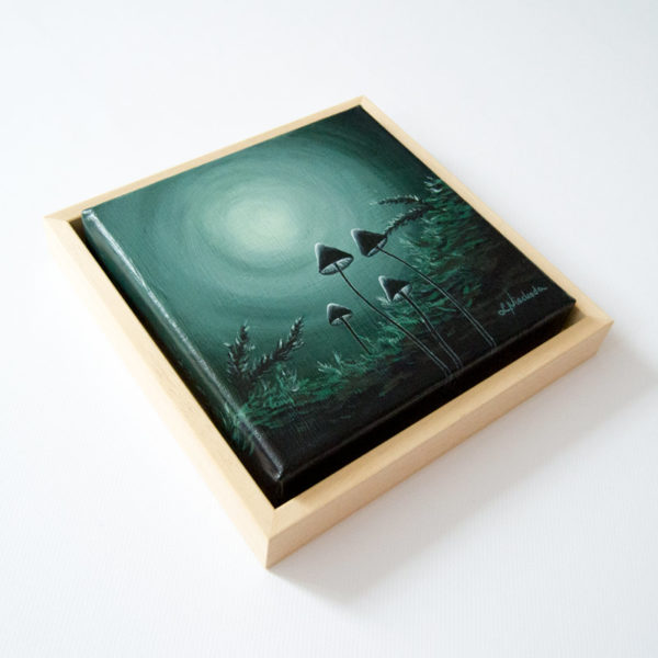 framed painting of a moonlit forest
