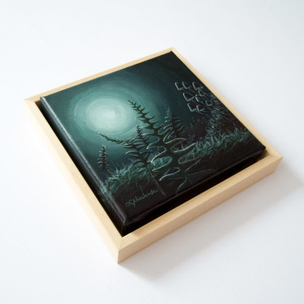 framed painting of a moonlit forest